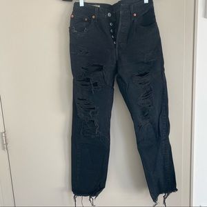 Distressed black Levi 501 jeans
